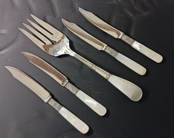 Antique flatware. Four fruit knives and a Sterling Silver serving fork. All have MOP handles. The knives have Sterling bands. Free Shipping.