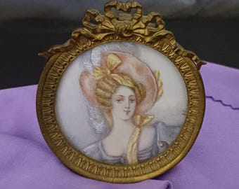 Antique, French, mini painting Lady in pink hat. It is in an ornate bronze frame. Signed. From the 1880's. Fast, free shipping to U.S.A.