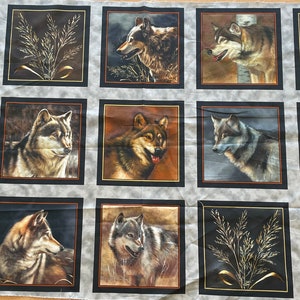 May include: A fabric panel with 12 squares featuring wolf images. Each square has a different wolf image with varying backgrounds and colors. The fabric is gray with black borders around each square.