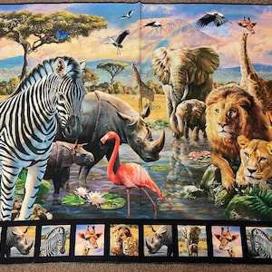 May include: A fabric panel featuring a vibrant African savanna scene with a zebra, rhinoceros, elephant, giraffe, lion, lioness, and flamingo near a water hole. A rainbow arches over a mountain in the background. A border at the bottom displays smaller individual portraits of the animals.