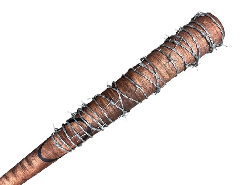 May include: A brown wooden baseball bat wrapped with barbed wire. The bat is weathered and has a dark brown stain on the handle.
