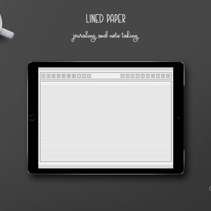 May include: A black tablet displaying a digital lined paper design for journaling and note-taking. The tablet is on a dark gray surface, with a cup of coffee and paper clips nearby. The text "LINED PAPER journaling and note taking" is at the top.