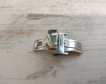 Strap clip. Automatic. Stainless steel. Butterfly clasps for watches of various designs. With a folding mechanism.