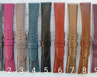 May include: Nine different coloured leather watch straps. The straps are all the same size and style, but they are different colours. The colours are silver, pink, beige, teal, black, red, gold, brown, and purple.
