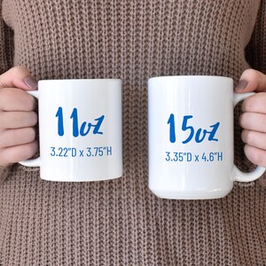 May include: Two white ceramic mugs with blue lettering. The smaller mug is 11oz and measures 3.22 inches in diameter by 3.75 inches in height. The larger mug is 15oz and measures 3.35 inches in diameter by 4.6 inches in height.