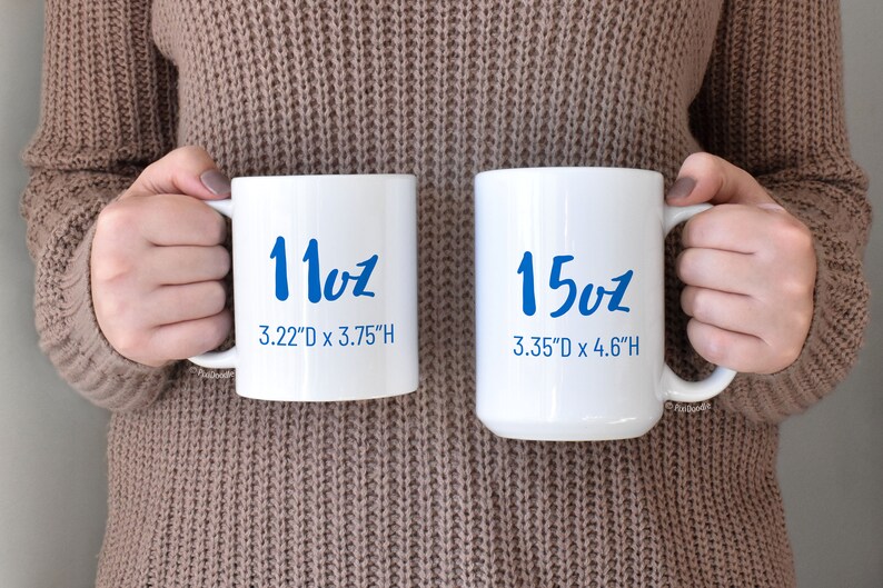 May include: Two white ceramic mugs with blue lettering. The smaller mug is 11oz and measures 3.22 inches in diameter by 3.75 inches in height. The larger mug is 15oz and measures 3.35 inches in diameter by 4.6 inches in height.
