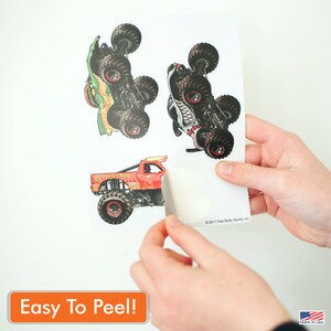 May include: Three monster truck stickers on a white sheet of paper. The stickers are easy to peel off the backing paper. The monster trucks are red, green, and white with black tyres. The stickers are printed with the text "El Toro Loco" and "2017 Feld Motor Sports, Inc."