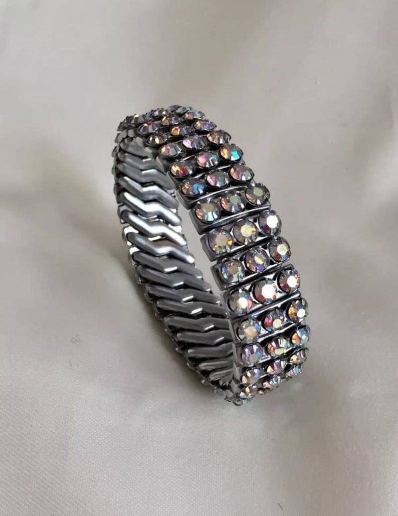 Glamorous 1950s silver tone rhinestone diamant\u00e9 aurora borealis cuff bracelet pin up