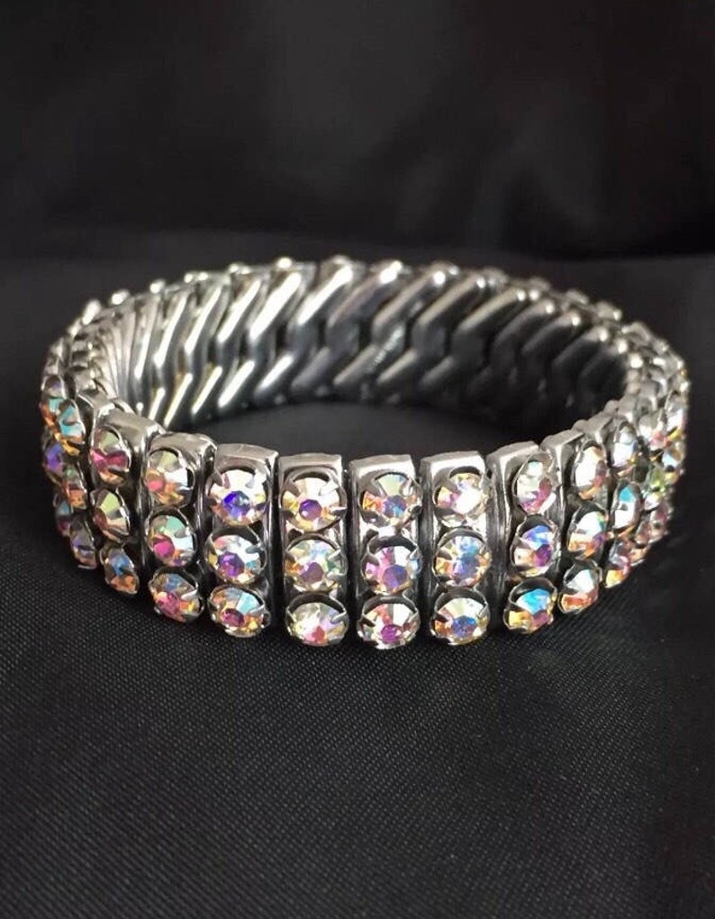 Glamorous 1950s silver tone rhinestone diamant\u00e9 aurora borealis cuff bracelet pin up