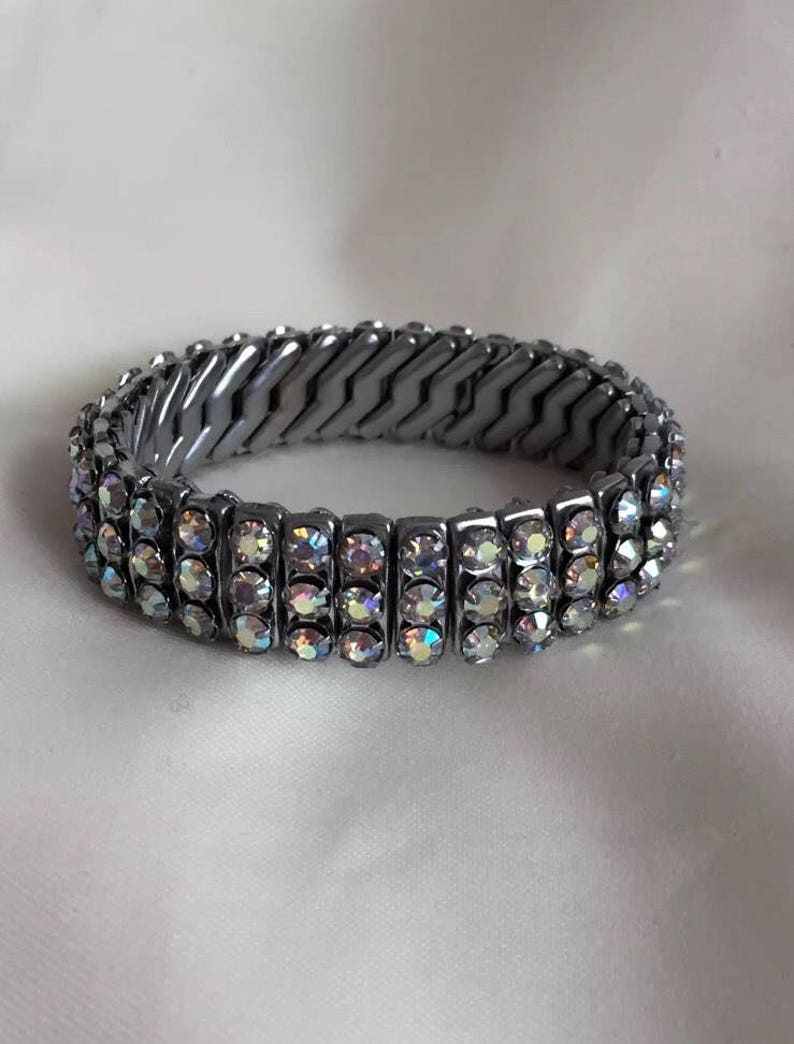 Glamorous 1950s silver tone rhinestone diamant\u00e9 aurora borealis cuff bracelet pin up