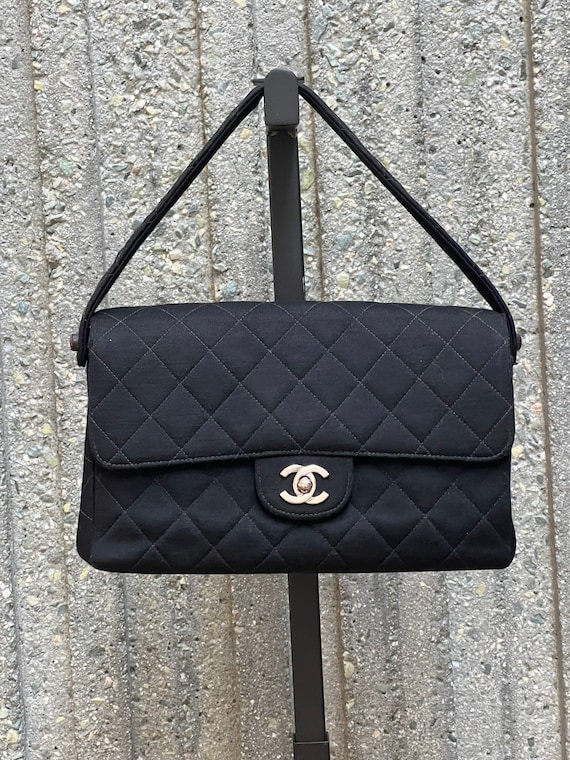 Bonhams : Chanel Black Lambskin Classic Double Flap Bag, c. 1991-94,  (Includes serial sticker, dust bag and box)