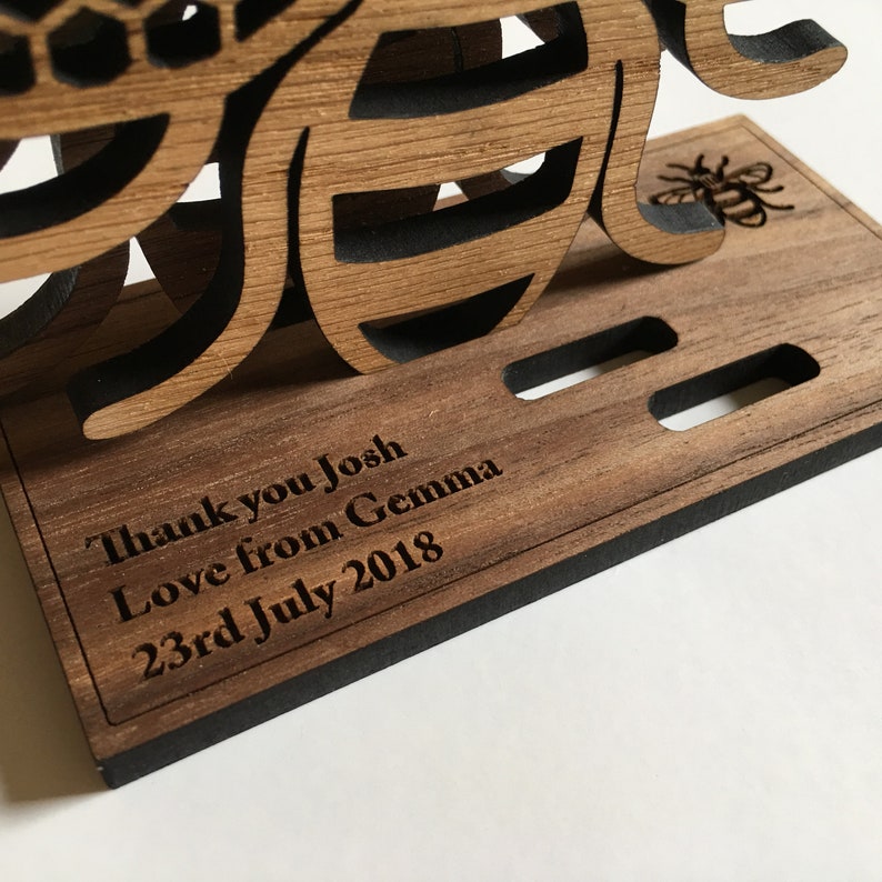 Personalised engraved stand for a set of Manchester Bee coasters