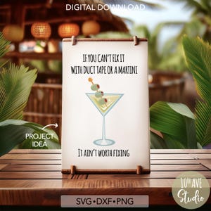 May include: A white sign with a brown wood frame and the text "If you can't fix it with duct tape or a martini it ain't worth fixing". A martini glass with olives is illustrated on the sign.