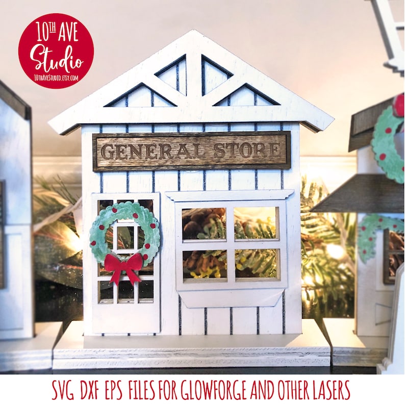 May include: A white wooden general store building with a green wreath on the door and a window with pine cones. The sign above the door reads "GENERAL STORE".