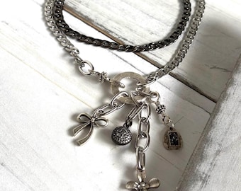 Gold and Gunmetal layered necklace,mix charms,flower,silver bow,pave bubble,silver charms.