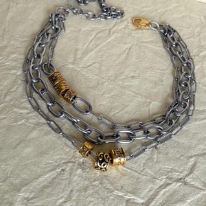 Multi layer  necklace with three silver chains and gold boho beads.Stainless steel chain,gift for her