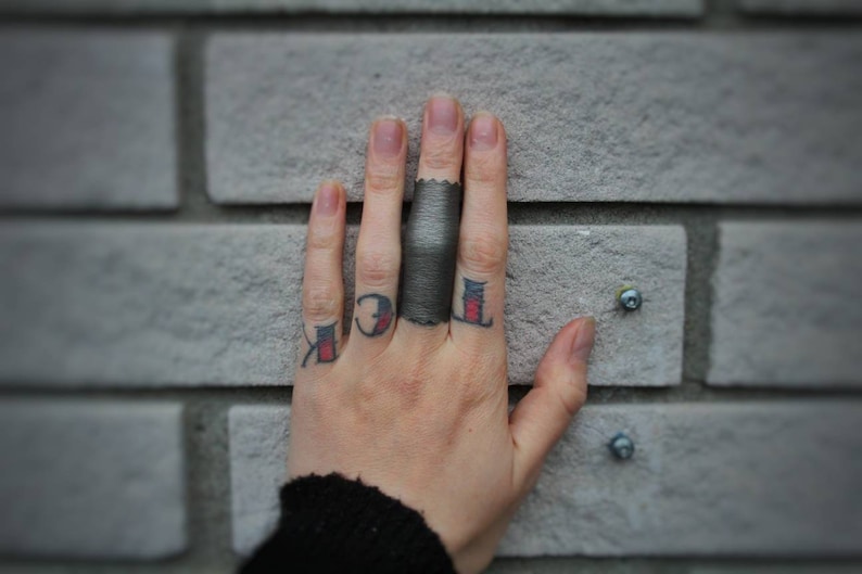 END Of The WORLD shiny silver stretch vegan leather ring