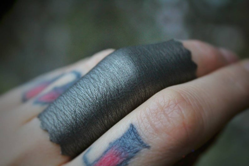 END Of The WORLD shiny silver stretch vegan leather ring