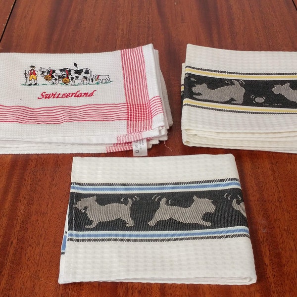 Dish Towels Made with a Cotton Waffle Weave Fabric with a Band of Dogs or Cows and "Switzerland".