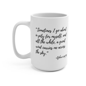 May include: White ceramic mug with a black quote that reads "Sometimes I go about in pity for myself, and all the while, a great wind carries me across the sky." -Ojibwe saying