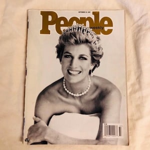 May include: A vintage People Weekly magazine from September 15, 1997, featuring a black and white cover portrait of Princess Diana wearing a tiara, pearl necklace, and drop earrings. The magazine title is printed in large gold lettering at the top.