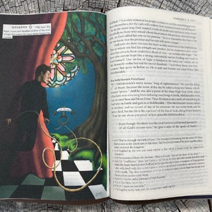 May include: An open book with a red and blue illustration of a man holding a rope attached to an anchor. The text on the page reads "HEBREWS 6" and "Melchizedek's Priesthood".