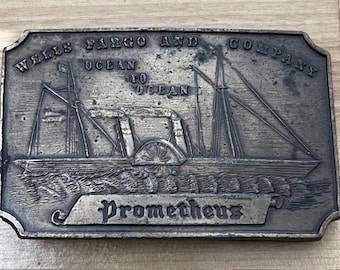 Hebilla de cinturón vintage de latón con diseño náutico del océano del banco Wells Fargo & Co.