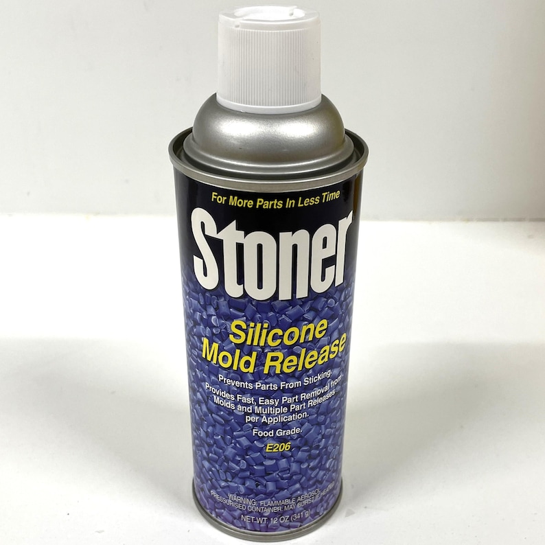 May include: A silver can of Stoner Silicone Mold Release, a product that prevents parts from sticking. The can is labeled with the product name and instructions for use. It is 12 ounces (341 g).