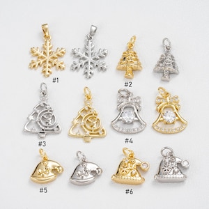 May include: A collection of gold and silver Christmas-themed pendants. Designs include snowflakes, Christmas trees, bells, and Santa hats. Each pendant is detailed with various textures and embellishments, perfect for holiday jewelry or craft projects.