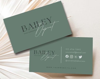 May include: Two business cards with a sage green background. The top card displays the name "Bailey Dupont" in a script font, with "Photography" below. The bottom card includes contact information: phone number, email, and social media handles.