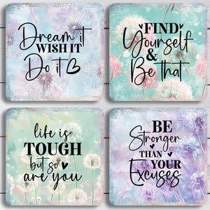 May include: Set of four square coasters with inspirational quotes. Each coaster features a watercolor background with dandelions and text: "Dream it, Wish it, Do it", "Find Yourself & Be That", "Life is Tough but so are you", and "Be Stronger Than Your Excuses".