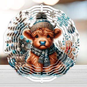 May include: A round, white Christmas ornament featuring a Highland cow wearing a hat and scarf. The cow is surrounded by a Christmas tree, snowflakes, and a gingerbread man. The ornament has a layered design.