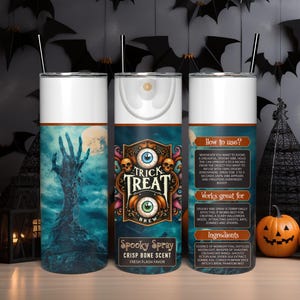 May include: A stainless steel tumbler with a spooky Halloween design. The tumbler features a blue and white illustration of a zombie hand reaching out of a grave. The text "Trick Treat Brew" is printed on the tumbler in a vintage style font. The tumbler is also labelled "Spooky Spray Crisp Bone Scent Fresh Flash Flavor".