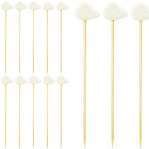 May include: A set of 20 white seashell cocktail picks. The picks are made of wood and have a white seashell on top. The seashells are shaped like hearts.