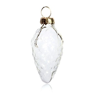 May include: Clear glass Christmas ornament shaped like a bunch of grapes with a gold metal top.