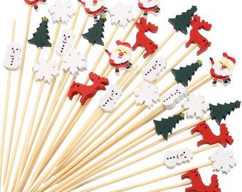 May include: A set of 30 wooden Christmas themed picks for decorating food or drinks. The picks feature a variety of designs including snowmen, reindeer, Christmas trees, snowflakes, and Santa Claus.
