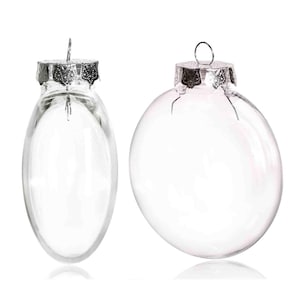 May include: Two clear glass Christmas ornaments with silver tops. The ornaments are round and oval shaped.