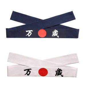May include: Two fabric headbands with a red circle and black Japanese characters. The top headband is navy blue and the bottom headband is white.
