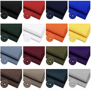 May include: A collection of sixteen folded fabric swatches in various solid colors including black, red, navy, royal blue, dark green, white, orange, yellow, light blue, burgundy, olive, purple, brown, tan, dark gray, and light gray.
