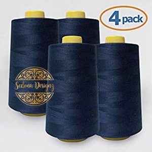 May include: Four spools of dark blue sewing thread with gold tops. The spools are labeled "Sedona Designz".
