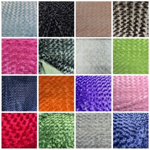 May include: A collection of 16 different colors of faux fur fabric. The fabric has a textured, fluffy surface. The colors include light blue, black, beige, brown, pink, gray, white, green, navy blue, orange, purple, light pink, red, dark green, silver, and blue.