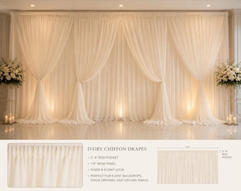 May include: Ivory chiffon drapes featuring a sheer, flowy texture with a 3-4 inch rod pocket and a 115 inch wide panel. The fabric is displayed as a gathered event backdrop with floral arrangements on stands at each side of the curtain setup.