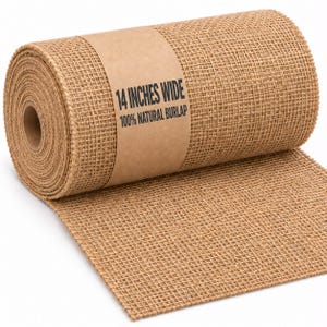 May include: A roll of tan, woven burlap fabric with a visible grid texture. A brown paper band wraps around the center, printed with the black text 14 INCHES WIDE and 100% NATURAL BURLAP. The fabric is unrolled slightly at the bottom edge.