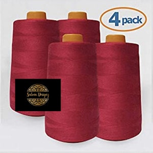 May include: Four spools of red sewing thread, each with a gold label. The label reads "Sedona Designz". The spools are arranged in a row, with the label facing the viewer. The image also includes a white circle with the text "4 pack" in blue.