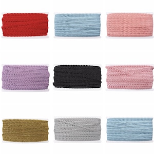 May include: Nine spools of decorative trim in various colors, including red, light blue, pink, purple, black, gold, gray, and a second light blue. Each spool is tightly wound and ready for use in craft projects.