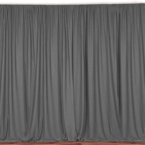May include: A gray backdrop made of fabric with a smooth, even texture. The backdrop is wrinkle-free and has a subtle sheen.