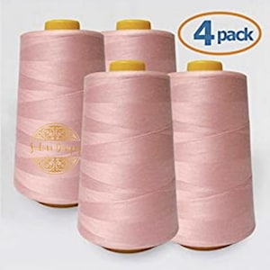May include: Four spools of pink sewing thread, each with a yellow top and a label that says "Salon Supply".