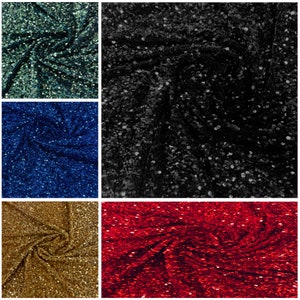 May include: A collage of five fabric swatches, each with a sequined texture. Colors include dark teal, black, navy blue, gold, and red. The fabric is draped and swirled, showcasing the reflective quality of the sequins. Ideal for apparel and craft projects.