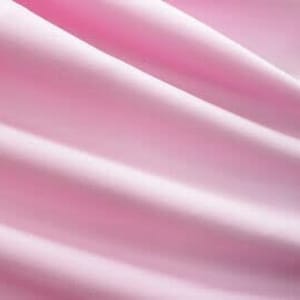 May include: A smooth, soft, pink fabric with gentle folds and wrinkles.