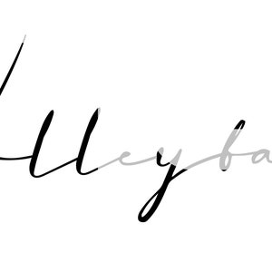 May include: Black and white handwritten text that says "Volleyball" with a gray heart drawn next to it.